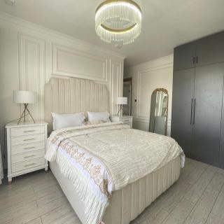 modern serenity suites apartments with swimming pool,modern equipped gym,private parking space, children playing ground, proximity to major shopping malls and unbeatable city views - 7