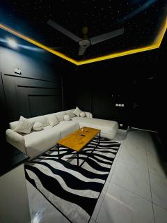 Dark Cozy 1BHK Sleep under the Stars Indoors with Swimming pool Gym and Cinema - 3