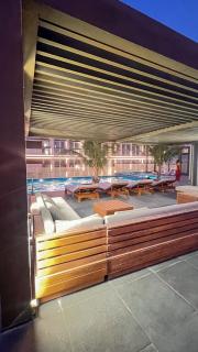 Chic 1BR Retreat with Infinity Pool and Sauna in JVC, Dubai - 8