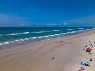 Ground floor direct oceanfront with a large patio, pool, and covered parking - 3