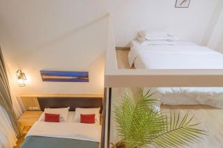 Heinemann Hotel loft suite with two king beds B306 with a jacuzzi and a local - 1