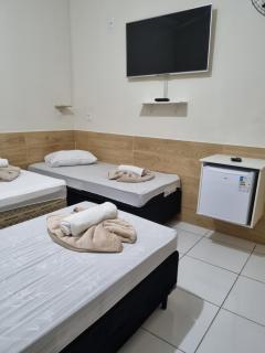 Pousada Quarto Standard com ar ,tv Wi-Fi Garagem gratuita - 8