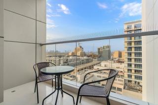 Charming 1BR with Balcony and City View in JVC - 8