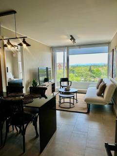 Espléndido y central depto en distrito Icono - 0