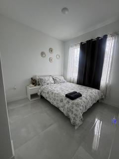 Modern room with kitchen and backyard access - 0