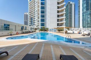 Vogue Vacation Homes, Marina Dorra Bay near JBR Beach and Ain Dubai, Two Bedroom apartment with Balcony, Canal and Skyline View, Access to all Amenities - 8