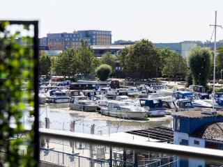 Chic Riverside View with Balcony Pass The Keys - 5