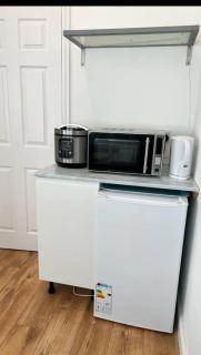 An En-suite with a mini kitchen and a work space - 3