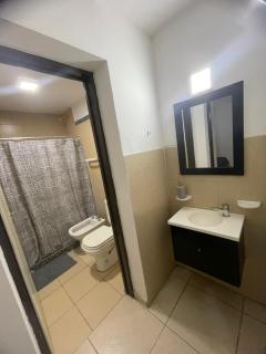 Departamento frente al shopping con patio - 9