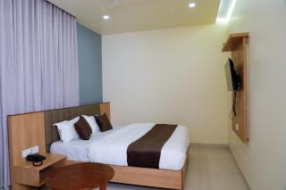 Atithi Deluxe Rooms - 4