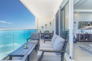 Relax in this modern ocean front condo Encantame E1404 - 1