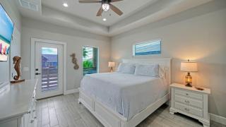 Bayfront Home w Pool Game Room Walk to Beach Golf Cart Access Pelican’s Perch by AvantStay - 6