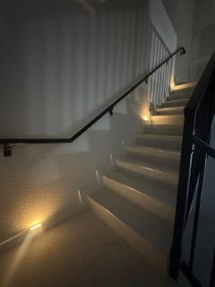 Modern room with kitchen and backyard access - 1