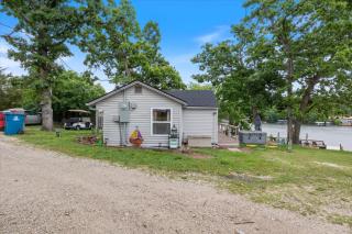 Lakefront Fishing Retreat w/ Dock, Hot Tub & Deck Views - 0