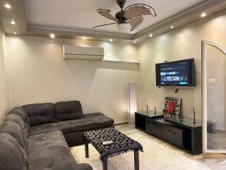 Stylish 2BR, 5 min to CAI Airport, Balcony, Free Snacks - 8