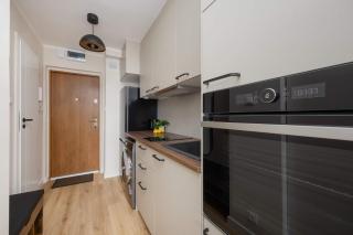 A Unique Studio with a Beautiful View of the Palace of Culture and Science by Noclegi Renters - 1