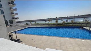 85 inch TV & Boho style apartment in Yas Island - 8