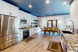 Hillside Hideaway ~ Dog-friendly home with wraparound deck, grill, game room, & bar - walk to dining - 4