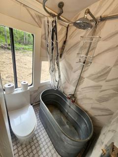 Rustic Converted School Bus with Outdoor Shower Near ORV Trails in Manistee National Forest, Michigan - 9