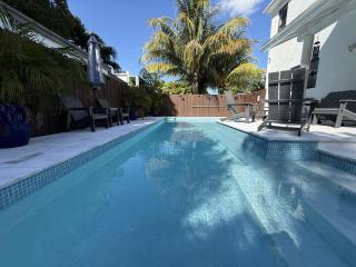 Stay Central: Relax in Our Heated Pool Oasis - 7