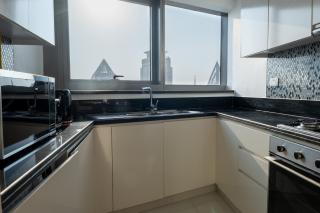 Aarna Signature holiday home - Modern 2BR With Full sea view -High floor - 2
