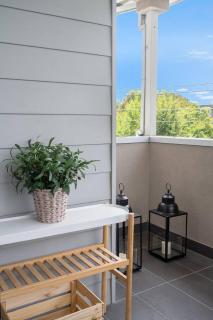 Stylish City Edge Home with Balcony and Parking - 1