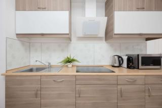 Cosy One-Bedroom Apartment with Parking & Balcony by Noclegi Renters - 1