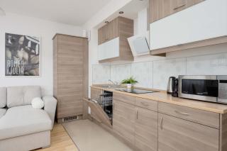 Cosy One-Bedroom Apartment with Parking & Balcony by Noclegi Renters - 1
