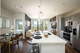 Stylish Downtown 2BR Retreat with Parking and Pool - 8