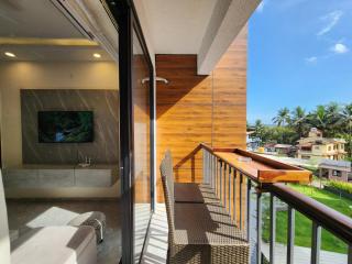 Calm 1BHK Modern Apartment in Candolim with Pool, Balcony & Modern Decor - 1