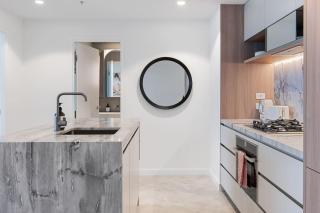 Stylish 1BR Retreat with Stunning High-Rise Views - 2