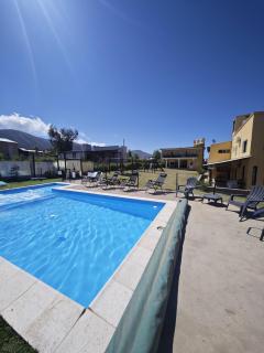 Suites Amplias y Comfortables - Con Balcon, Parquizado, Asador y Pileta - 5