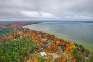 Cozy Houghton Lake Home with Fire Pit and Porch - 0