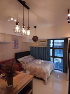 Elivion Staycations in McKinley Hill BGC with Pool near Venice Mall - 5