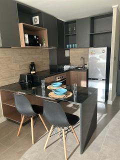 Departamento Nuevo 1D1B con estacionamiento sobre stripcenter y supermercado - 7