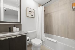 Modern Townhouse Luxe Walk-In Closet- 65 TV - 6