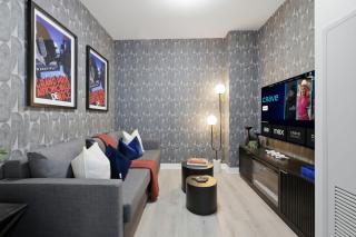 Modern Townhouse Luxe Walk-In Closet- 65 TV - 0