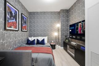 Modern Townhouse Luxe Walk-In Closet- 65 TV - 5