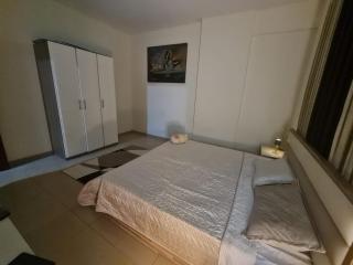 A bedroom a kids room a living room and two bathrooms - 2