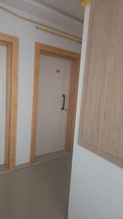 A one-bedroom apartment with a living room, kitchen, and balcony - 4