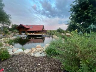 Blockbohlen HolzHaus mit Sauna, Outdoor Jacuzzi und BadeTeich - 0