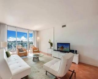 Bright Two-Bedroom Oceanfront Condo With Balcony and Coastal Views - 0