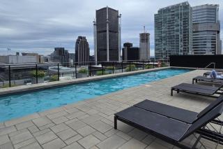 Pet-Friendly Furnished 1B Rental in Montreal with Skyline Views & Concierge - 2