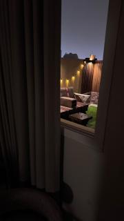 Elegant studio with 65-inch screen and outdoor seating - 2