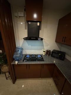 Cozy 2BHK Apartment in Bahria Self Check-in, Balcony, PS4 & Projector - 1