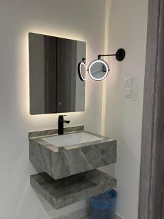 شقة بغرفة معيشة وغرفة نوم - 4