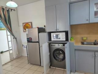 Palm-Shaded 2BR Retreat with Pool in Grand Bay - 3