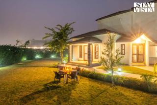 StayVista at Olive fields with Shared pool, BBQ - 9