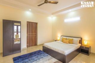 StayVista at Olive fields with Shared pool, BBQ - 8