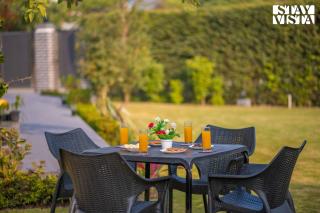 StayVista at Olive fields with Shared pool, BBQ - 6